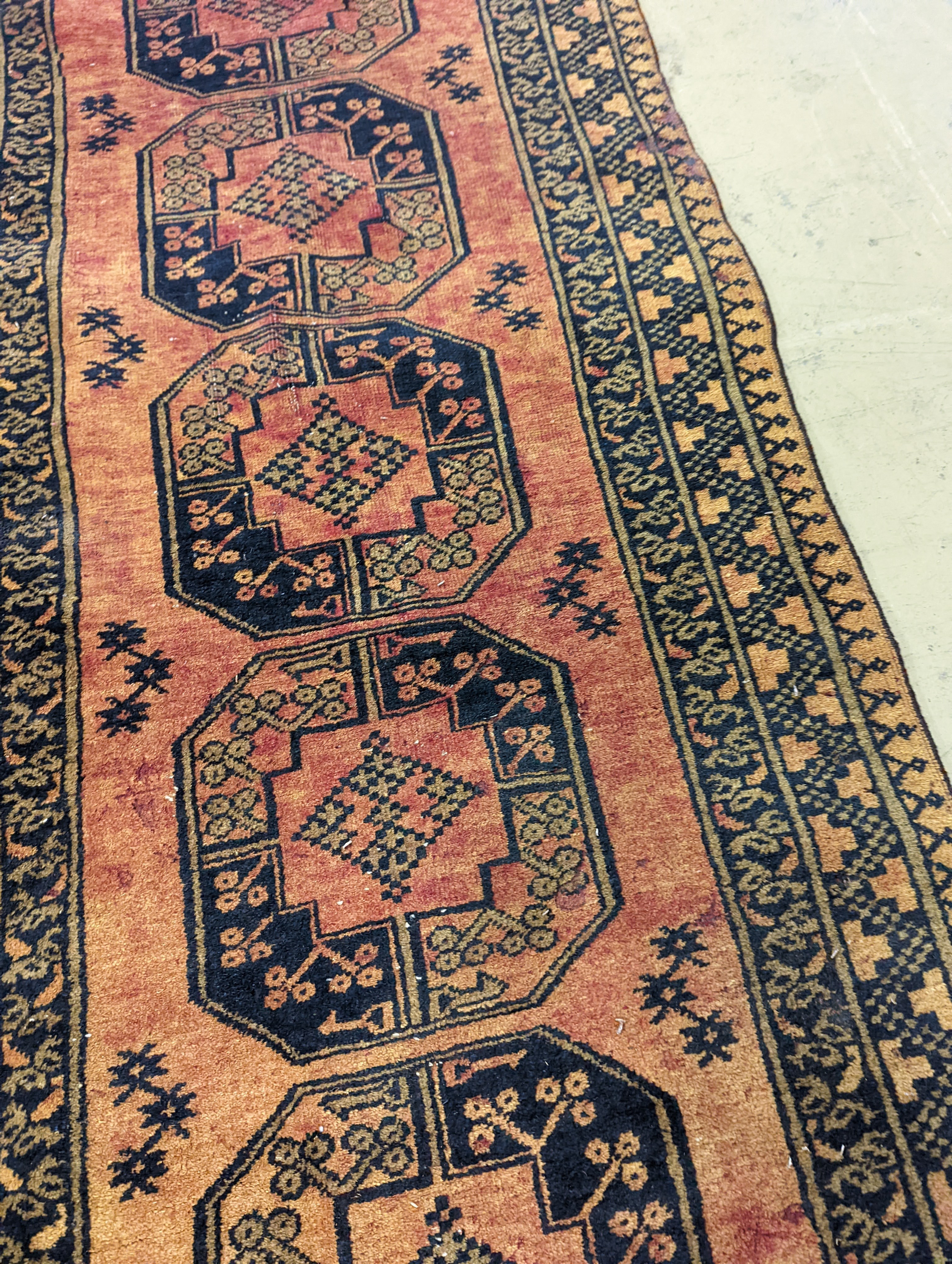 An Afghan geometric runner, 300 x 86cm